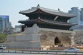 Namdaemun, front of gate, left side (signboard is still covered)