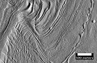 Surface of Nilosyrtis Mensae showing ridges and cracks, as seen by HiRISE, under the HiWish program.