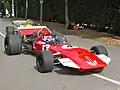 Initially Surtees raced with a red car with white accents