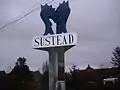 The Village sign