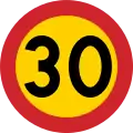Swedish 30&nbsp;km/h speed limit – the yellow background provides a contrast in case snow covers the background against which one perceives the road sign.