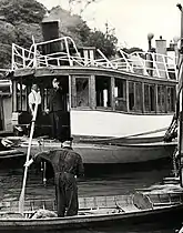 Owner Charles Rosman (wearing braces), on the Rodney after she was refloated