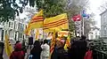The Vietnamese anti-government sentiment displaying the former flag of South Vietnam in front of the Vietnamese embassy in Hague. The Embassy itself is flying the red Socialist Republic flag alongside the flag of ASEAN.