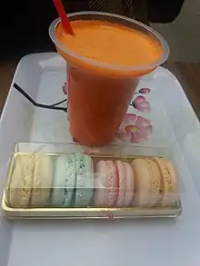 A Box of macarons and a glass of carrot juice in Tabriz, Iranian Azerbaijan