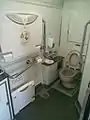 Universal access toilet in car 634-12