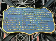 badge shaped plaque with details of foundation of the tank