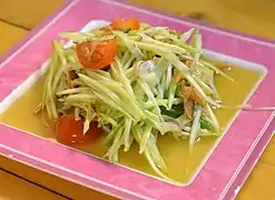 A variation of the salad with green mango instead of papaya and dried anchovies (tam mamuang pla haeng thot)