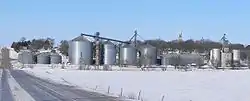 Tarnov seen from the east.  In the foreground are grain bins along the Nebraska Central Railroad track; on the hill right of center is the steeple of St. Michael's Catholic Church.