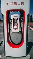 Tesla Supercharger stall with charging cable-outlet