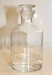 Photograph of a glass bottle of tetrahydrofuran