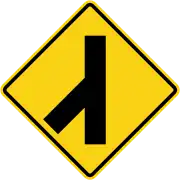 Skewed side road junction on left