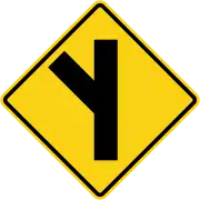Skewed side road junction on left