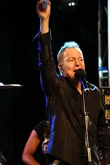 Schneider performing in 2009