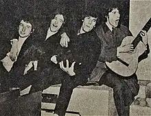 The four Kinks pose and play for the photographer