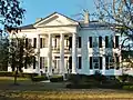 The Pillars is a Greek Revival antebellum plantation home that was built in 1857 by Archibald Tyson, a cotton planter from North Carolina.