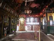 The inside of the Church of Panagia Trypiti in the rock. (The holy icon of Panagia is visible in the background)