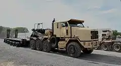 An Oshkosh M1070A1 HET and a DRS M1000 semi-trailer