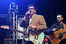 Flansburgh (center) performing with Dan Miller (right) as They Might Be Giants in October 2010