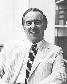 the article subject dressed in a jacket and necktie, facing the camera