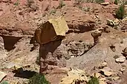 An ancient rockfall which protected the rock records beneath its impact site from further large scale erosion. Taken along Burr Trail, Grand Staircase–Escalante National Monument, Utah, USA.