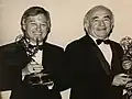 Ed Asner presents the 1990 Emmy for outstanding television documentary series, “Planet Earth” to Tom Skinner.