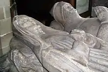 Isabel de Lingen (died 1446) and her first husband, Sir Fulke de Pembrugge (died 1409). Isabel founded the chantry and college at Tong for her own and her husbands' souls. It became the shrine church of the Vernon family of Haddon Hall. Her daughter by her second husband Sir John de Ludlow was Benedicta de Ludlow and is buried in the church