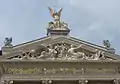 The Genius with the torch and other statues above the main entrance