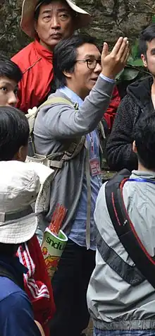 Trần Quang Đức (centre, raising his hand) at the Thầy Pagoda (September 2014).