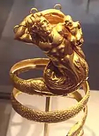 Gold armband with a bearded triton