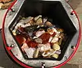 A 6.8 kg (15 lb) barrel full of tumble-polished agate and jasper