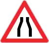 Road narrows on both sides