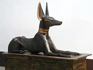 The Anubis Shrine; 1336–1327&nbsp;BC; painted wood and gold; 1.1 × 2.7 × 0.52&nbsp;m; from the Valley of the Kings; Egyptian Museum (Cairo)