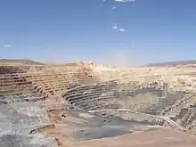 Machinery is minuscule compared to the size of this mine.