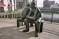 Two Men on a Bench, bronze, 1995, located at Wren Landing, Canary Wharf, London, Great Britain