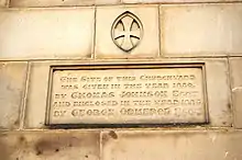 Engraving in a sandstone block which comprises part of a wall.