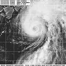 Satellite image of a weakening typhoon south of Japan. The storm's eye is mostly cloud-filled and cloud cover is mostly extending to the north of the center.