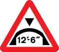 Warning of maximum headroom of arch bridge directly ahead (imperial)