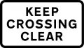 Supplementary plate warning drivers to not block the level crossing