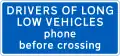 Information sign for large vehicles informing to phone at automatic level crossing