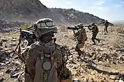 A fire team from the 2nd Marine Regiment advance toward their downed targets, wrapping up a live-fire ambush and reaction drill at Camp Billy Machen Desert Warfare Training Facility, Chocolate Mountain Aerial Gunnery Range (2009)