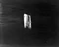 The bow of USS Fiske floating in the North Atlantic after she was broken in two by a torpedo from the German submarine U-804 on 2 August 1944. This section had to be sunk by gunfire. Photographed from an airplane based on USS&nbsp;Wake Island; note the sonar dome on Fiske's keel.