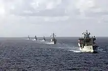 Wave Ruler (foreground), USS&nbsp;Mahan, Almirante Latorre, Sachsen, and USS&nbsp;Samuel B. Roberts navigate in formation.