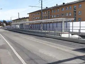 Island platform next to roadway