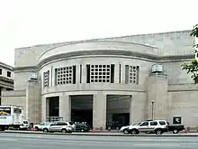 14th Street Entrance of USHMM. Large, rectangular façade with rounded opening.