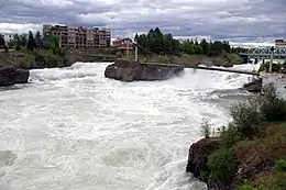 The Spokane River rushes passed Canada Island in Riverfront Park