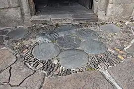 Pavement of forecourt of Abbaye Saint-Pierre of Uzerche (France).