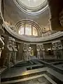 View from inside the crypt with the guarding warriors and death masks visible