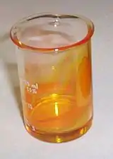 Impure vanadium oxytrichloride in a beaker