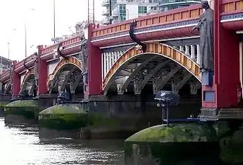 Image 44Vauxhall Bridge across the River Thames opened in 1906 and features sculptures by F. W. Pomeroy.