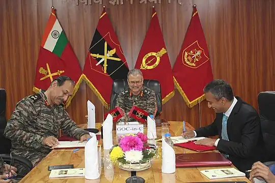 Vice-Chancellor Krishnaswamy signing an MoU with Major General V. M. Chandran from the Army Training Command regarding training army officers on cyber laws and legal studies